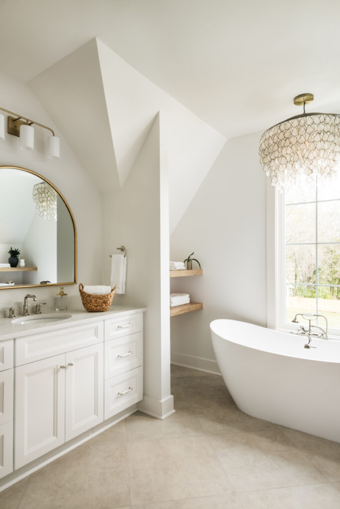 Luxury bathroom with freestanding soaking tub and vaulted ceiling in a move-in-ready Charlotte home